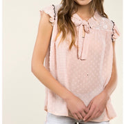 Pink polka dot Sleeveless top, featuring a front adjustable self tie bow, ruffle shoulder accents